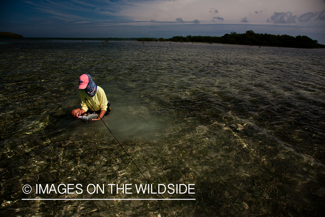 Flyfishing woman with bonefish.