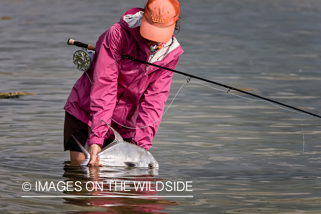 Flyfishing woman with permit.