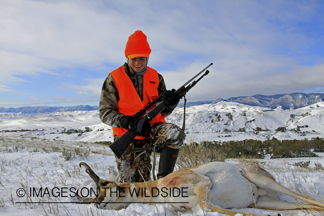 Young hunter with bagged pronghorn antelope. 