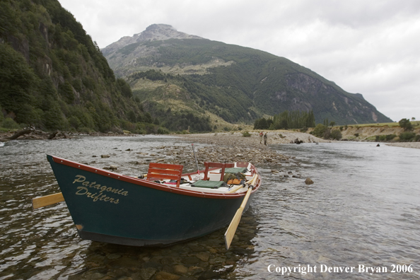 Flyfishermen on river with driftboat.