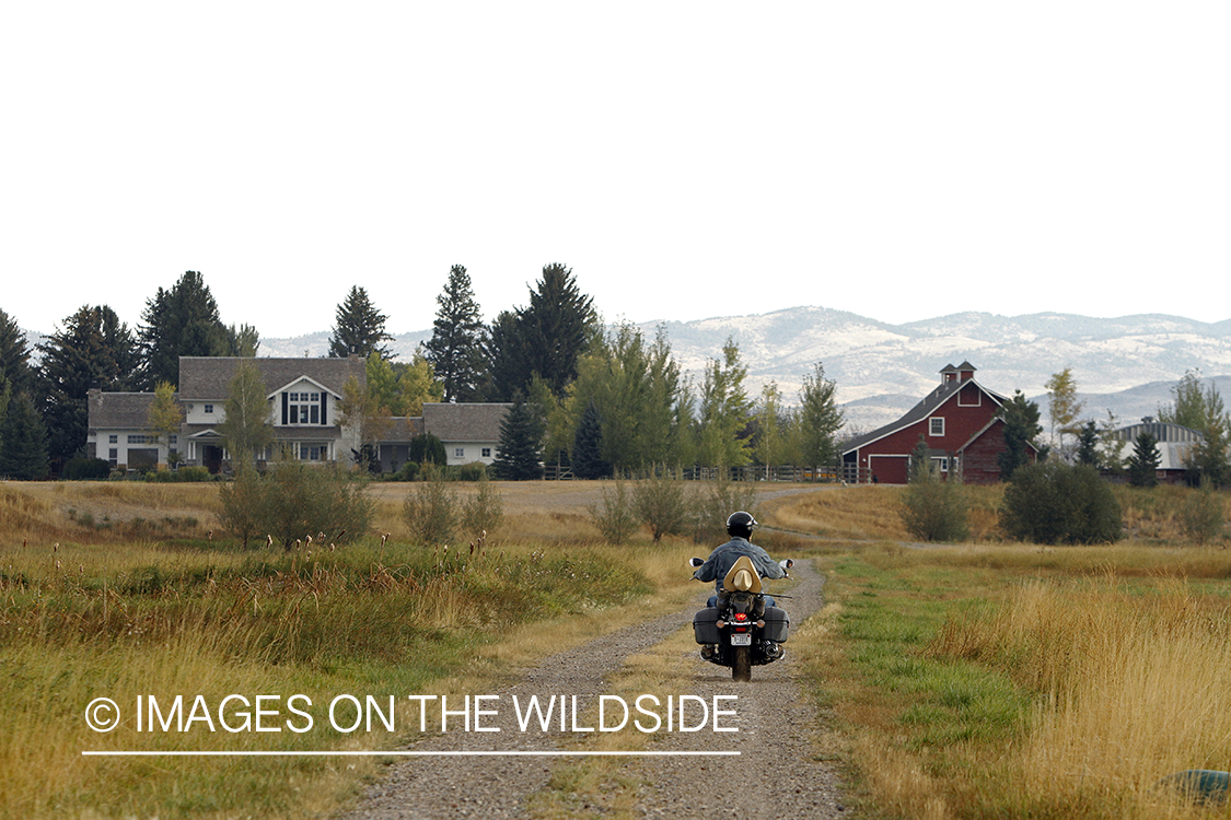 Flyfisherman on motorcyle.