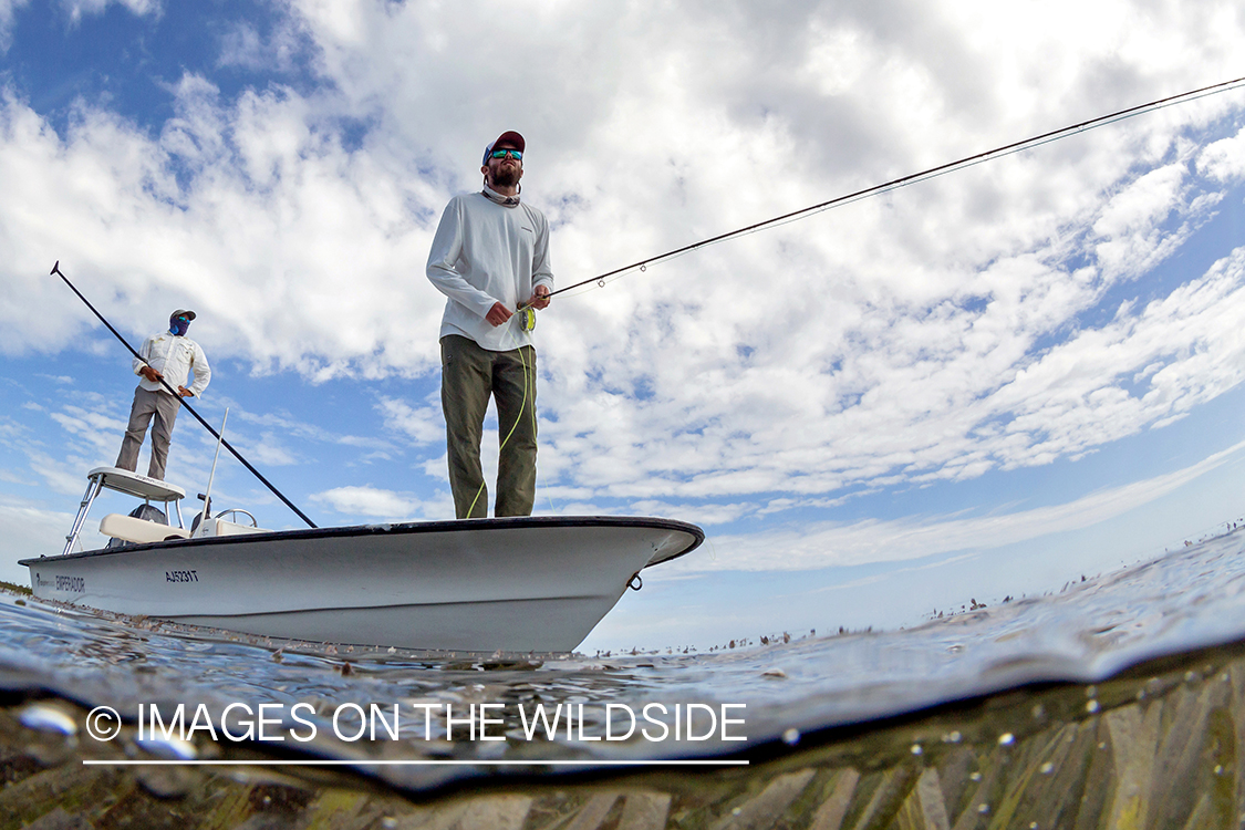 Flyfisherman on flats boat with guide.