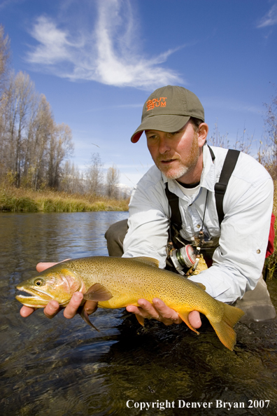 Flyfisherman with Snake River cutthroat trout.