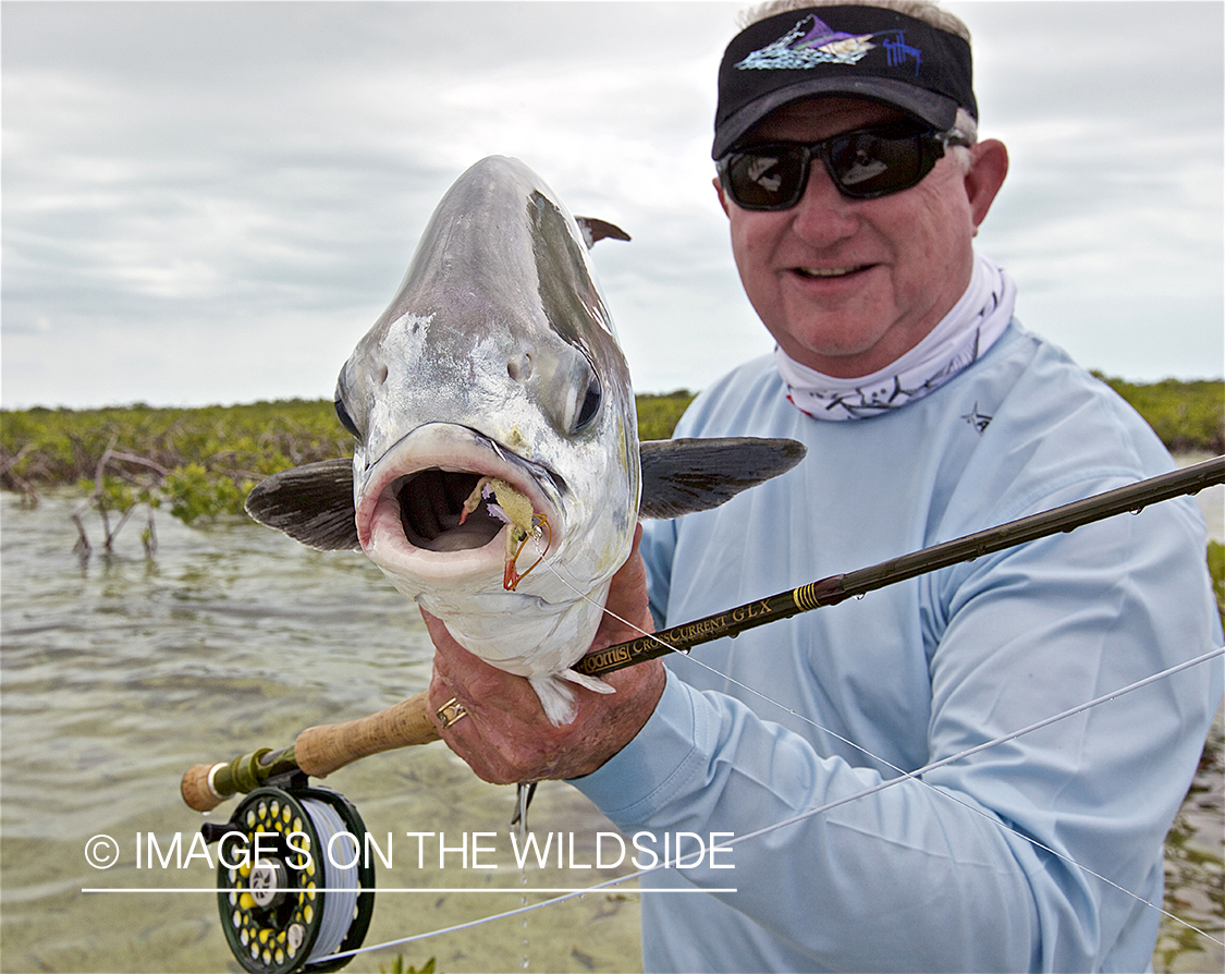 Flyfisherman with permit. 