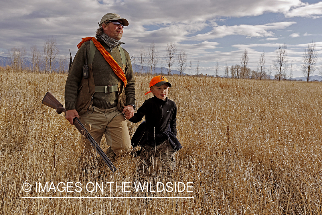 Father and son pheasant hunting. 