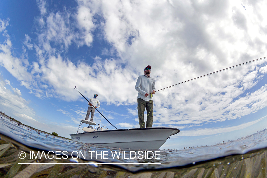 Flyfisherman on flats boat with guide.