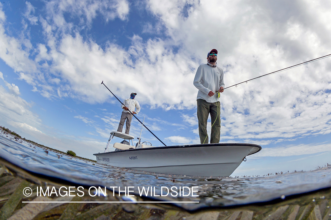 Flyfisherman on flats boat with guide.