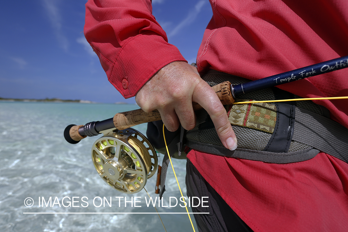 Saltwater flyfishing woman with rod.