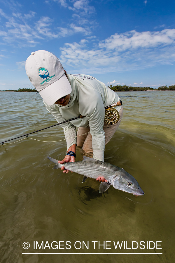 Flyfishing woman with bonefish.