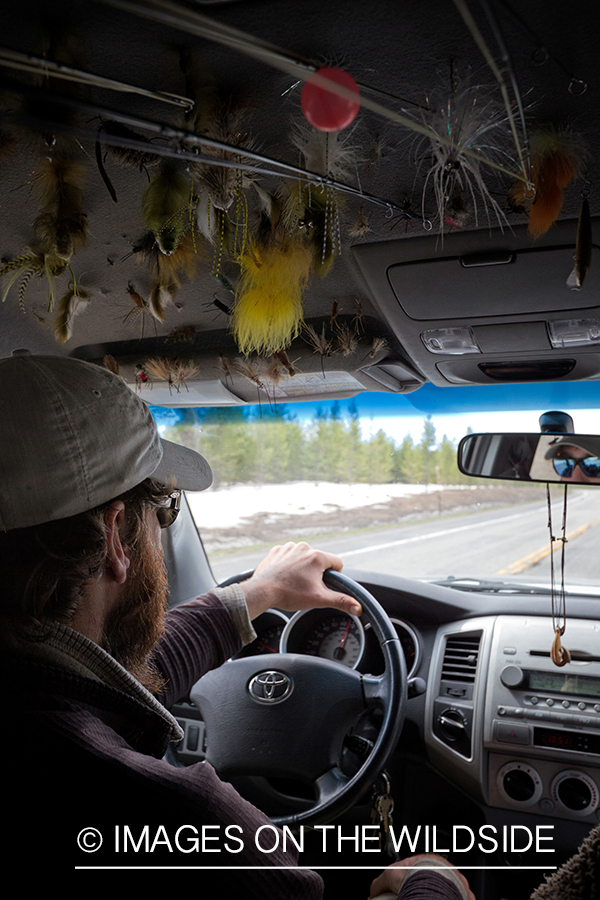 Flyfisherman in truck.