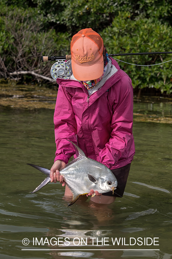 Flyfishing woman with permit.