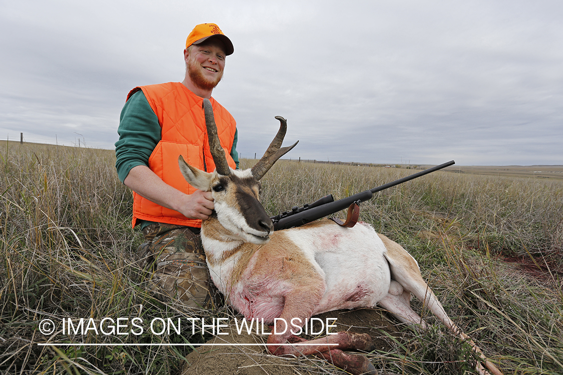 Hunter with pronghorn antelope buck.