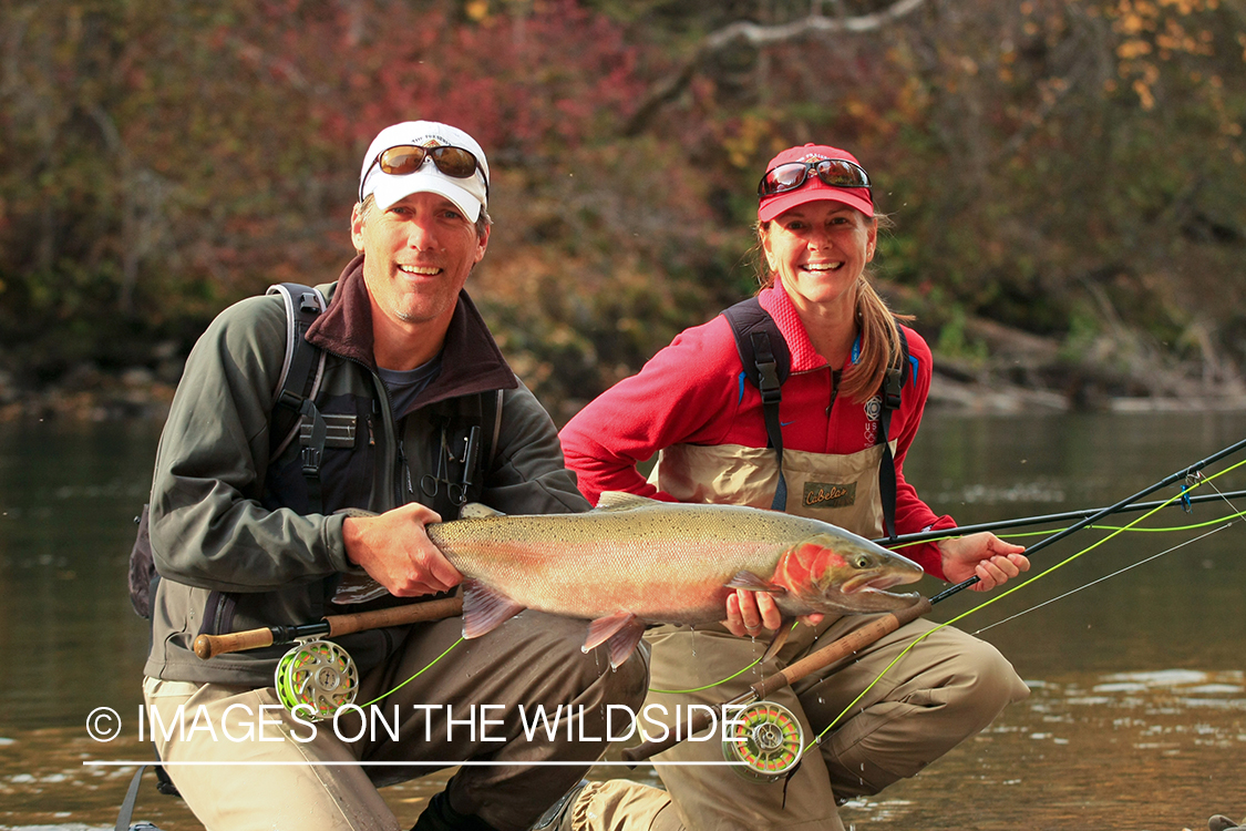 Flyfisherman and woman with Steelhead. 