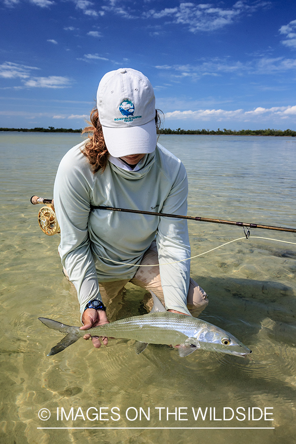 Flyfishing woman with bonefish.