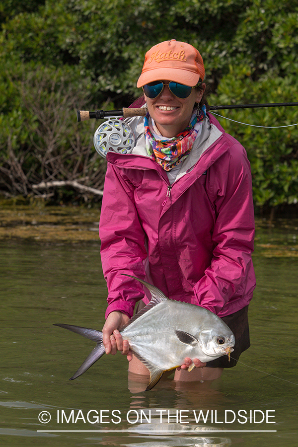 Flyfishing woman with permit.