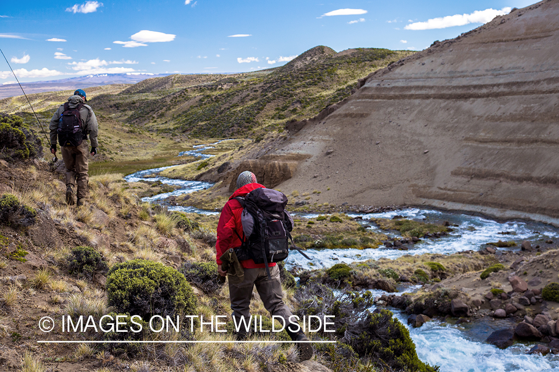 Flyfishermen scouting river in Argentina.