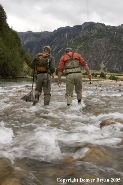 Flyfishermen walking up river.