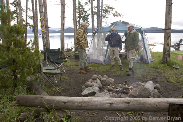 Flyfishermen at lakeside fishing camp.